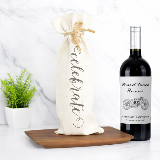 Celebrate wine gift with Cabernet Sauvignon bottle in canvas bag and wooden serving board