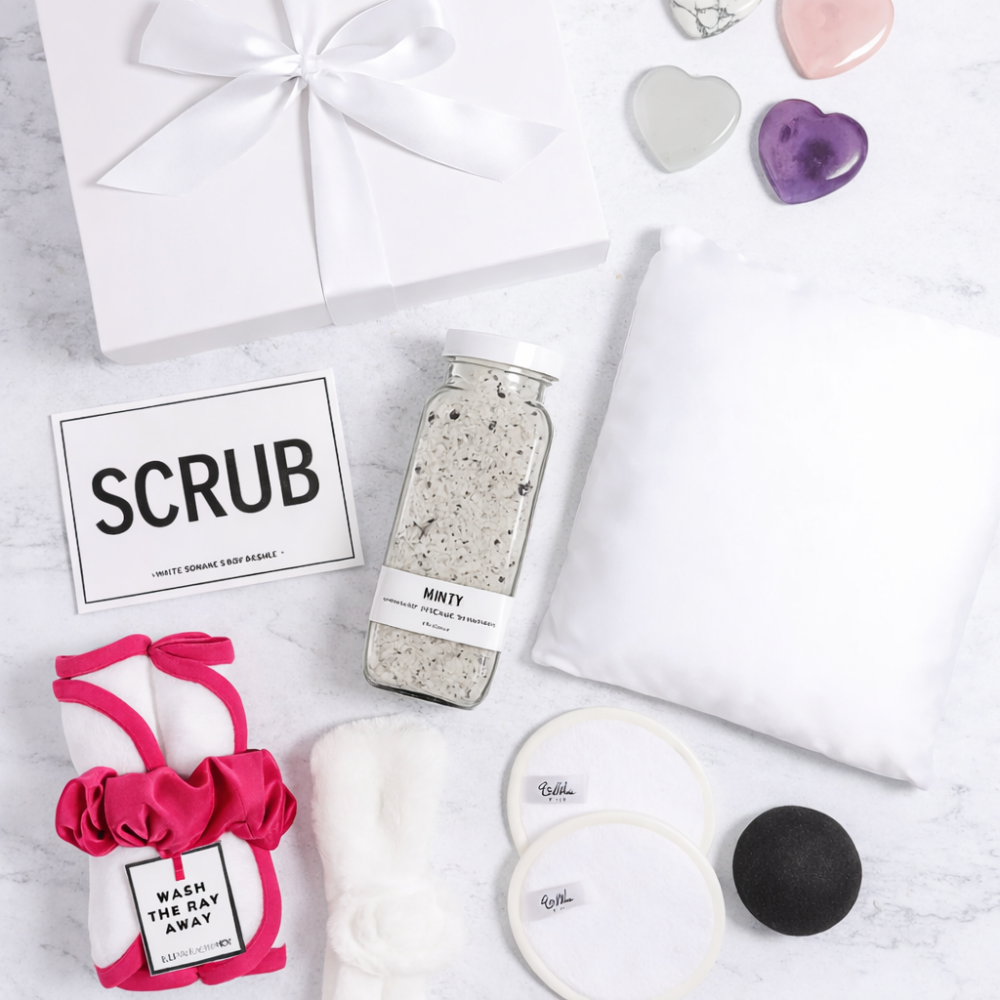 Collection of beauty products including a jar labeled 'SCRUB', a pink item with a bow, and heart-shaped objects on a white surface.