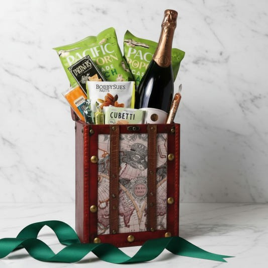 A travel-themed retirement gift for women, featuring popcorn, wafers, nuts, and sparkling spritz in a vintage-style chest. A perfect retirement gift for men or women who love gourmet snacks.