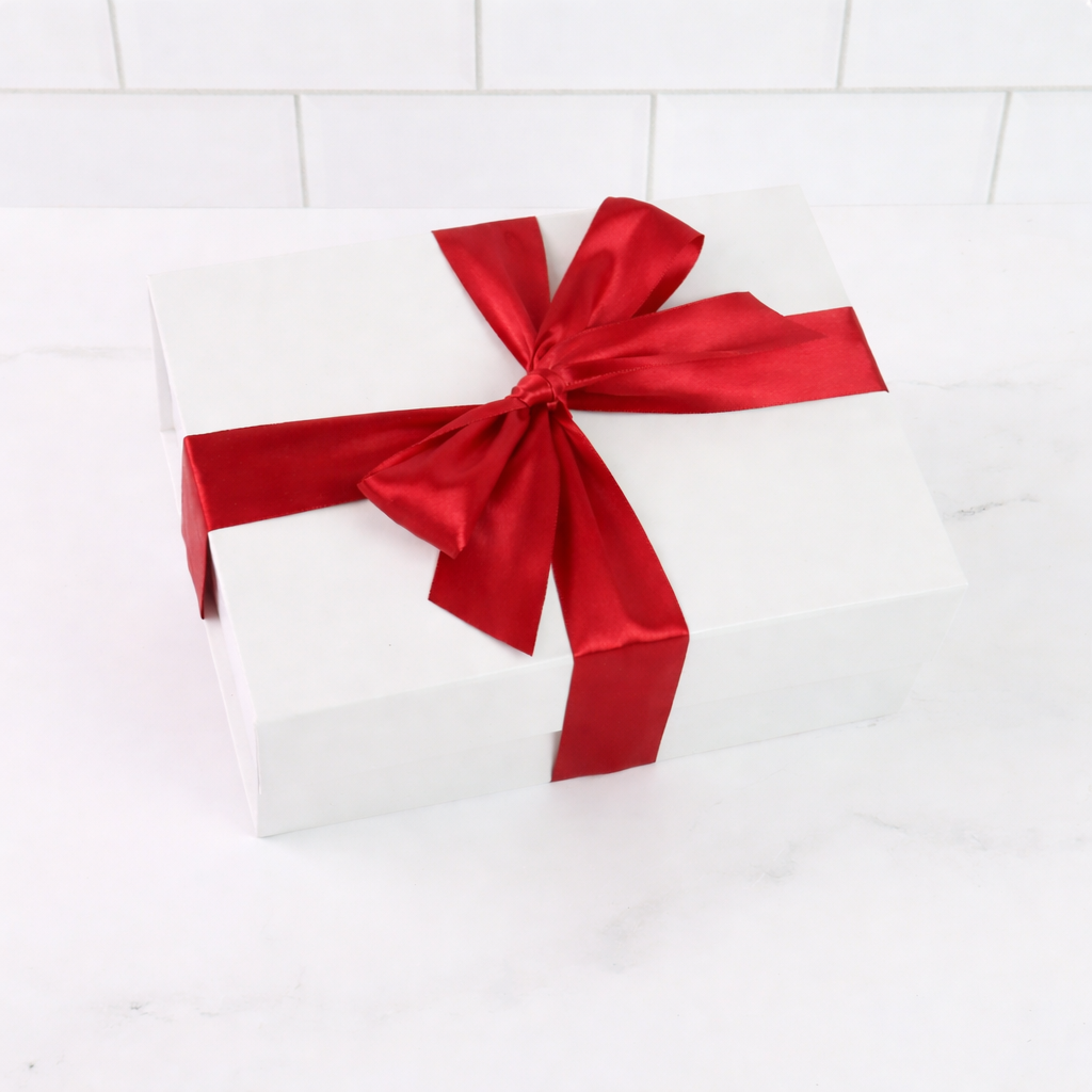 white gift box with red satin bow
